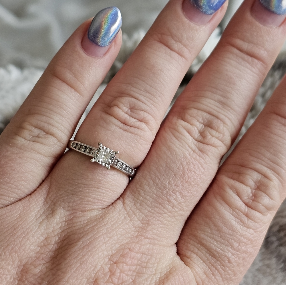 10k diamond ring size 7 1/4. Stamped 10k. Genuine diamonds. Could be resized my